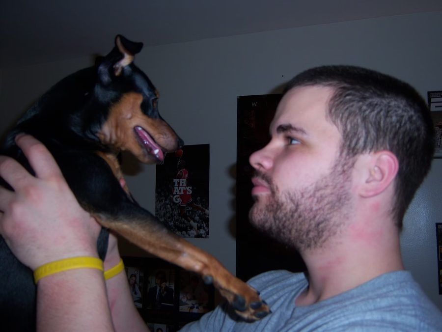 Kyle holding Deuce up face to face